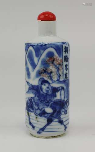 A small blue and white snuff bottle with underglaze copper r...