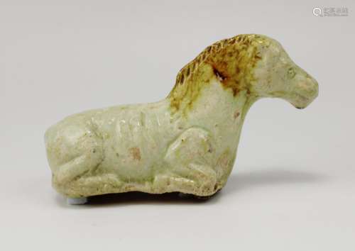A Liao Dynasty straw glazed reclining horse