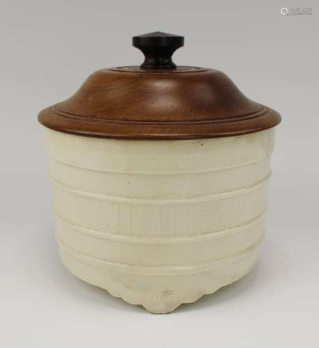 A creamy-coloured pottery censer with wooden cover