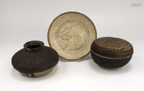 A small Song dynasty dish with incised decoration, with a bo...