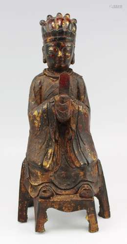 A Chinese lacquered and parcel-gilt cast-iron figure of Shan...