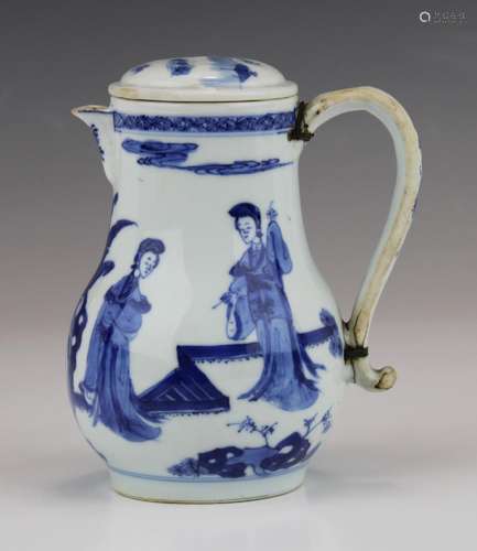 A blue and white covered pitcher