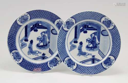 Two blue and white plates with figures