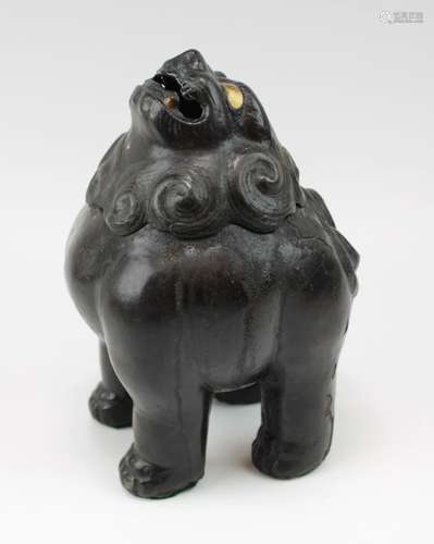 A heavy bronze foo-dog censer