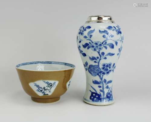 A cafe-au-lait bowl and a blue and white vase with silver mo...