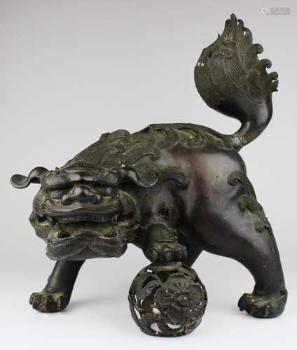 A Japanese bronze foo dog figural censer