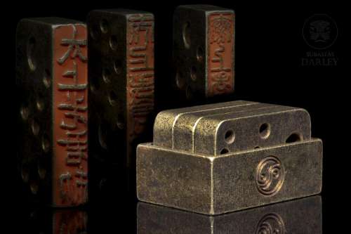 Set of three bronze stamps.