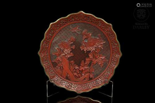 a Chinese cinnabar lacquer dish with chrysanthemums, 20th ce...