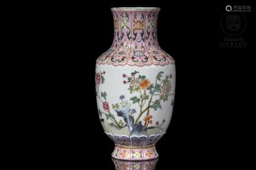 A famille rose "flowers and rocks" vase, with Qian...