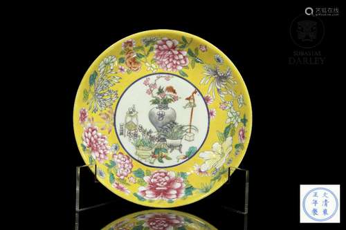 Dish of flowers and treasures with yellow background, 20th c...