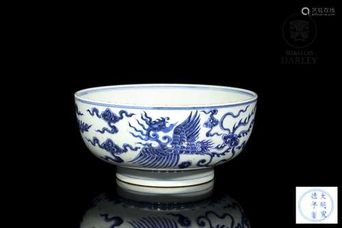 A blue and white "phoenix and dragon" bowl, 20th c...