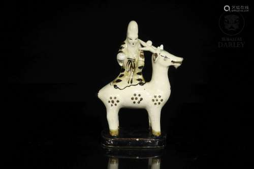 A glazed "Sage on horseback" figure, Asia, 19th - ...