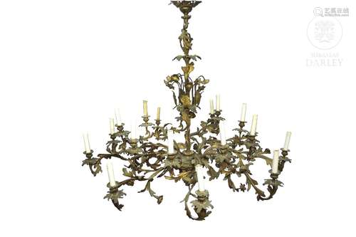 A large chandelier in golden metal, 20th century