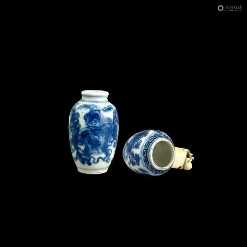 A blue and white 'lions' Snuffbottle; and a bird feeder, Gua...