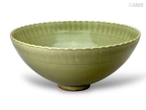 A carved celadon bowl with petalled mouth