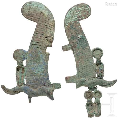 Two halves of Egyptian feather crowns with Uraeus serpents, ...