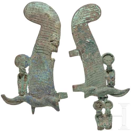 Two halves of Egyptian feather crowns with Uraeus serpents, ...