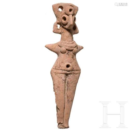 A northern Syrian clay idol of a woman, early 2nd millennium...