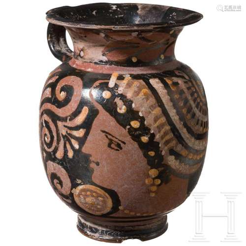 An Apulian oinochoe with depiction of a woman's head, la...