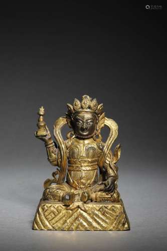 A CHINESE GILT BRONZE FIGURE OF STATUE