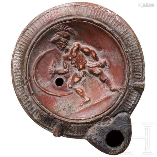 A Roman clay oil lamp with hoplite, 3rd quarter of the 1st c...