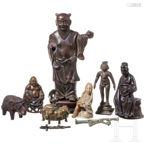 A small group of Asian bronze figurines, Chinese and Indian,...