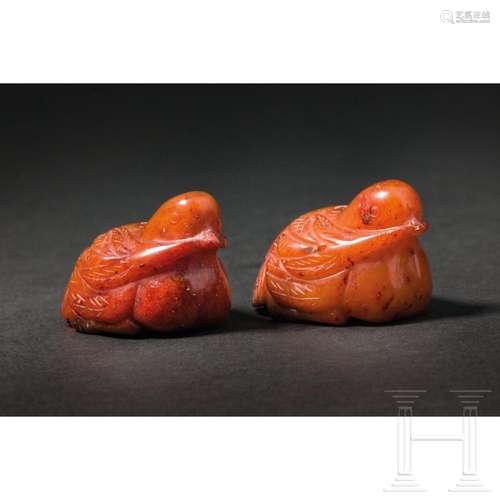 Two Chinese dug-shaped jade pendants, 20th century