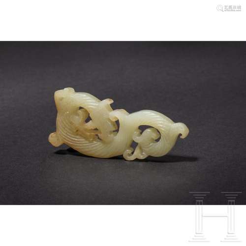 A Chinese S-shaped jade dragon pendant, 20th century