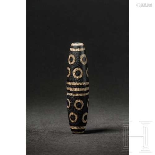 A Tibetan 14-Eye Dzi bead, 20th century