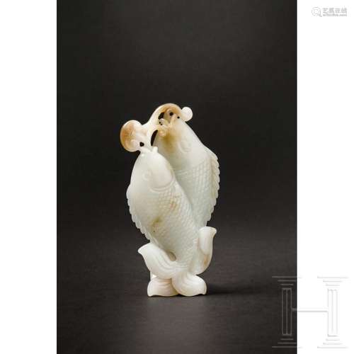 A Chinese double-fish-shaped jade pendant, 20th century