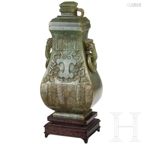 A Chinese lidded jade vase with vegetal decor, 20th century