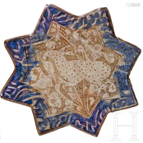 A star-shaped Iranian tile, Kashan, 13th/14th century