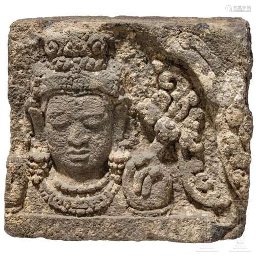 A Javanese relief stone with the head of Bodhisattva, 9th ce...