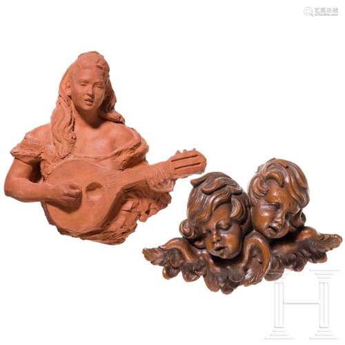 An Italian bozzetto of a lute player and carved angel heads,...