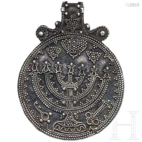 An Eastern European Jewish silver pendant with depiction of ...