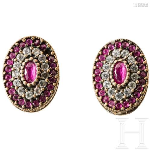 A pair of earrings with pink spinel