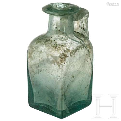 A Roman glass bottle, 2nd - 4th century