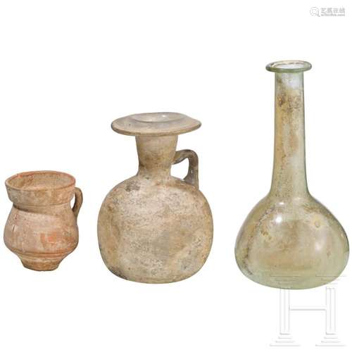 Two Roman glass vessels and a small clay vessel, 2nd - 3rd c...