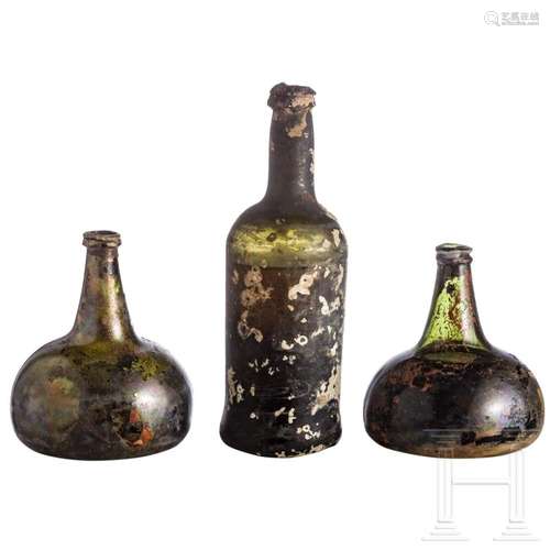 Three dark green glass bottles (onion bottles), Dutch, circa...