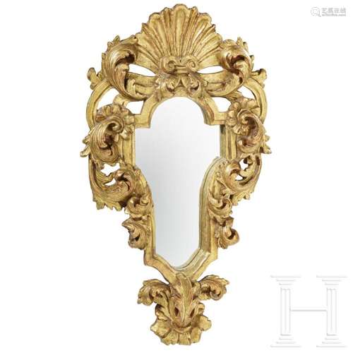 A mirror in a carved frame, probably German, 19th century