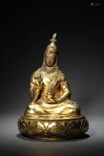 A CHINESE GILT-BRONZE FIGURE  OF STATUE