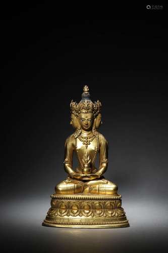 A CHINESE GILT-BRONZE FIGURE OF BUDDA