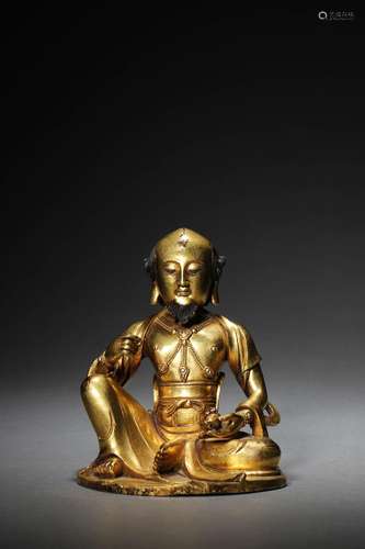 A CHINESE GILT-BRONZE FIGURE OF BUDDA