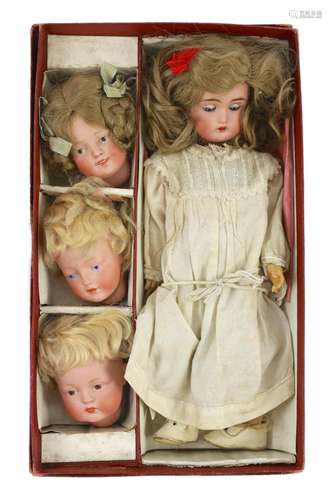 A rare J. D. Kestner bisque character doll, with three inter...