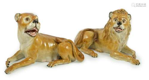 A pair of Meissen figures of a recumbent lion and lioness, 1...