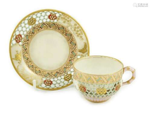 A Royal Worcester reticulated miniature cabinet cup and sauc...