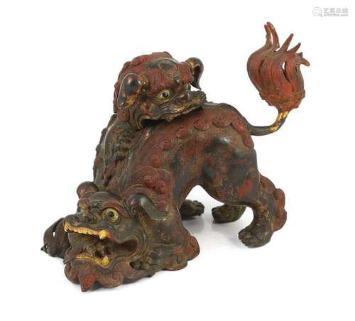 A large Japanese gilt and red lacquered bronze ‘shi-shi’ kor...