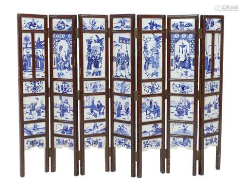 A Chinese blue and white panelled seven-fold low screen, lat...