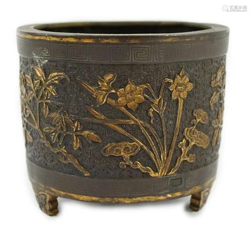 A Chinese parcel-gilt and silver inlaid bronze tripod censer...