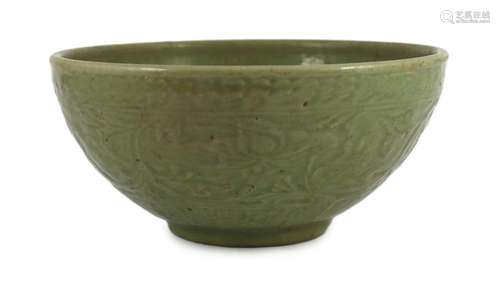 A large Chinese Ming carved Longquan celadon deep bowl, firs...